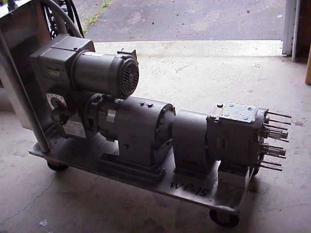 (1) Stainless Steel, rotary lobe, Waukesha Sanitary Pump.  Model 30.  Vari-drive (varible speed) motor, 2 HP, 230/460 V, 1725 RPMi, 425 - 4275 RPMo, max torque 72 in/lbs,   Has Square D control panel.  Portable on wheels.  Missing head.  (can be sold in parts, Waukesha Parts)